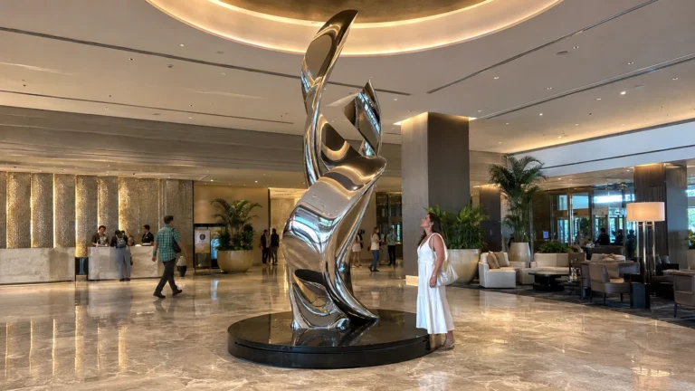 Custom stainless steel sculpture installed in a luxury hotel lobby